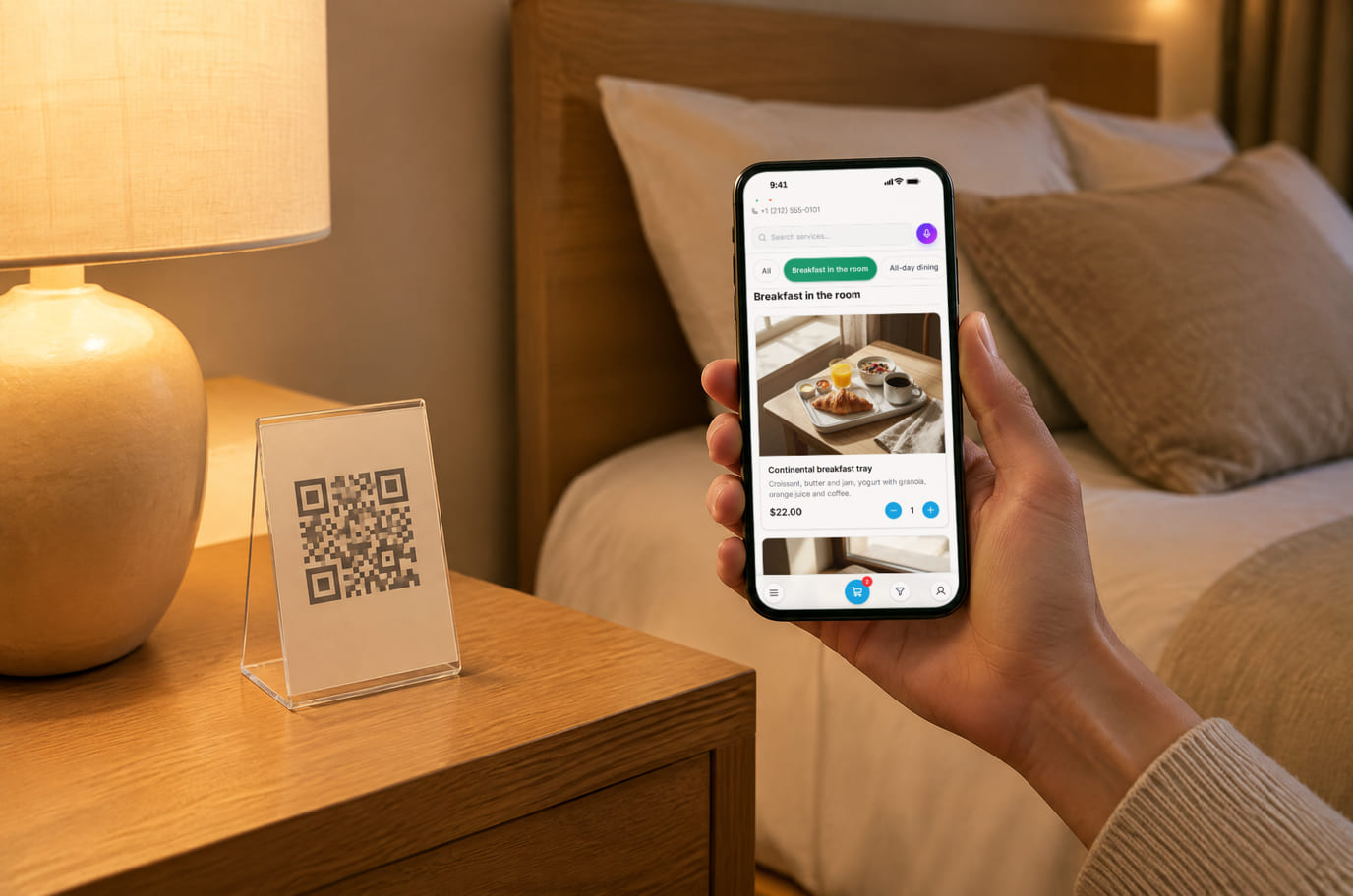 A hotel guest chooses breakfast for room service on a phone beside the bedside QR card